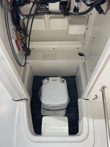 Slide: The Image of 2023 Robalo R180 Center Console interior wiring and storage compartment. - 11