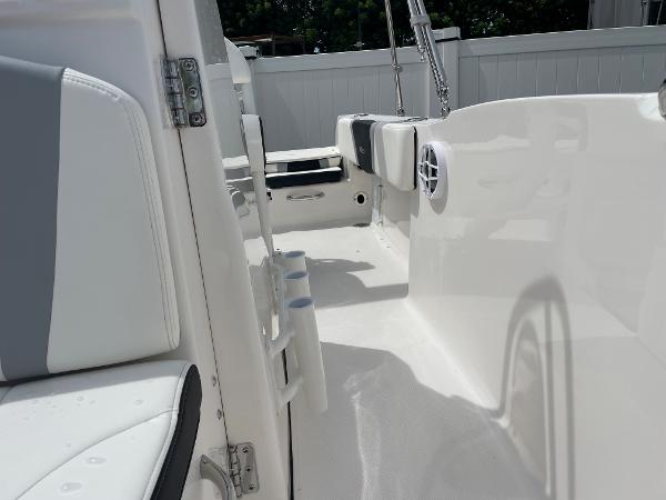 Slide: The Image of 2023 Robalo R180 Center Console boat interior with white seating and sleek design. - 13
