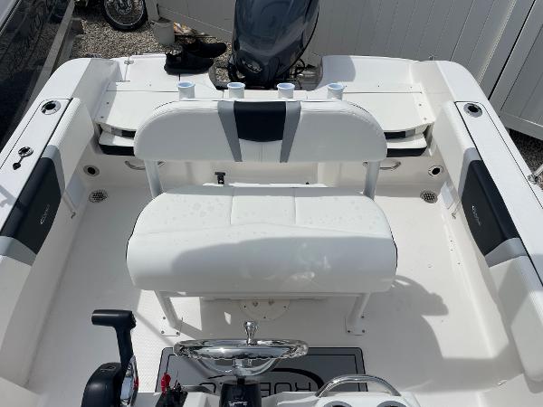 Slide: The Image of 2023 Robalo R180 Center Console boat interior with seating and steering wheel. - 16