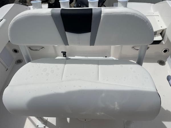 Slide: The Image of 2023 Robalo R180 Center Console boat seat with white upholstery. - 17