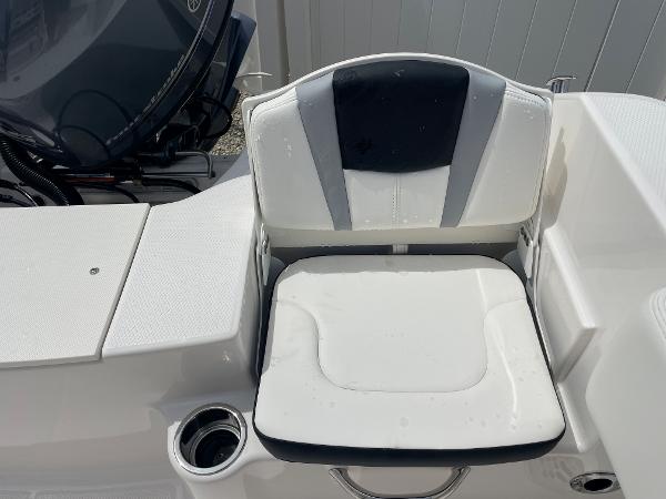 Slide: The Image of 2023 Robalo R180 Center Console boat seat with cup holder and storage. - 19