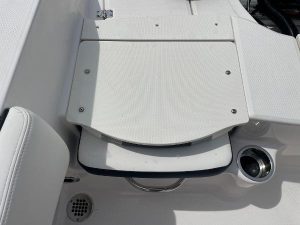 Slide: The Image of 2023 Robalo R180 Center Console boat seating area with cup holder. - 21