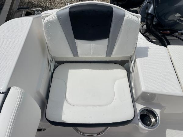 Slide: The Image of 2023 Robalo R180 Center Console boat seat with cup holder, white and black design. - 22