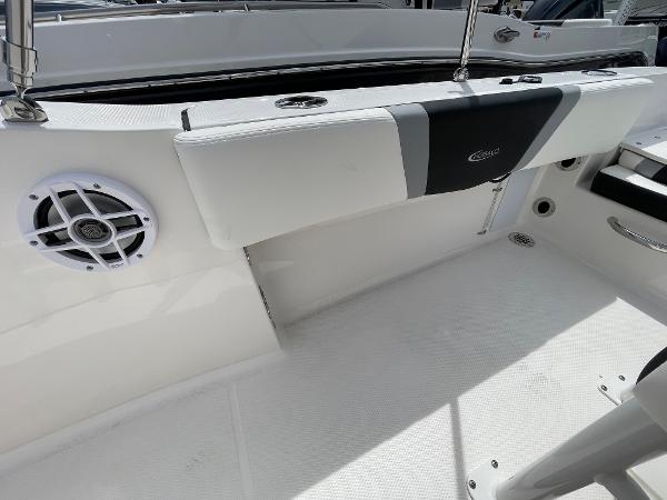 Slide: The Image of 2023 Robalo R180 Center Console interior with speaker and cushioned seating. - 27