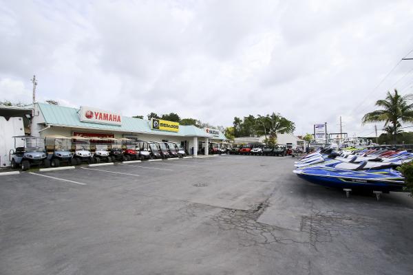 Slide: The Image of Outdoor dealership showcasing Yamaha, Sea-Doo, and Robalo R180 Center Console boats, 2023 models. - 46