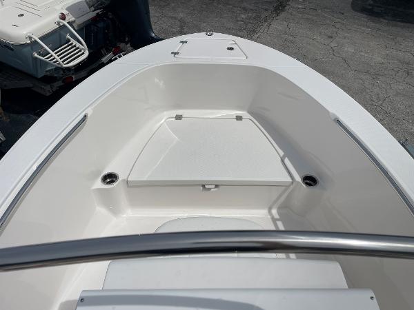 Slide: The Image of 2023 Robalo R180 Center Console boat interior with sleek white design. - 6