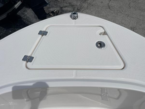 Slide: The Image of 2023 Robalo R180 Center Console boat deck with storage hatch. - 7