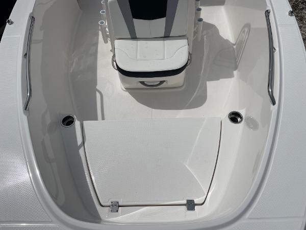 Slide: The Image of 2023 Robalo R180 Center Console boat interior with seating and storage. - 8