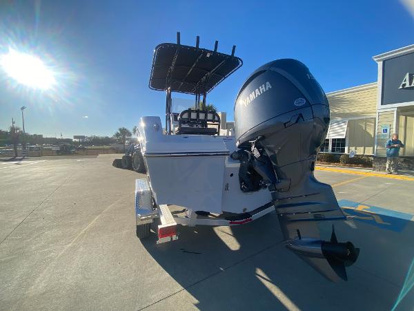 Slide: The Image of 2024 Robalo R200 Center Console boat with Yamaha outboard motor in parking lot. - 5