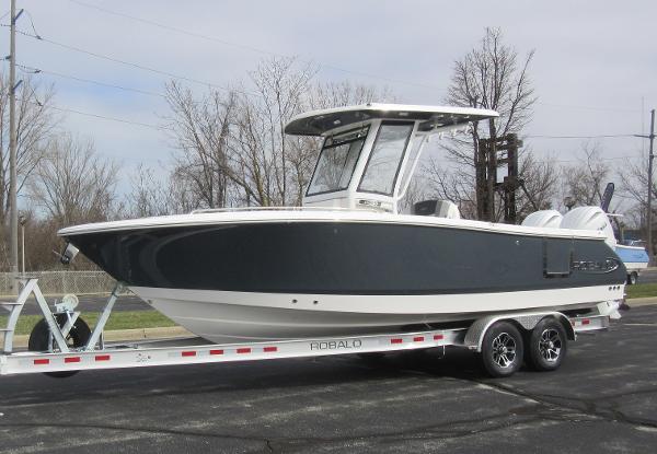 Slide: The Image of 2024 Robalo R250 Center Console boat on trailer. - 0