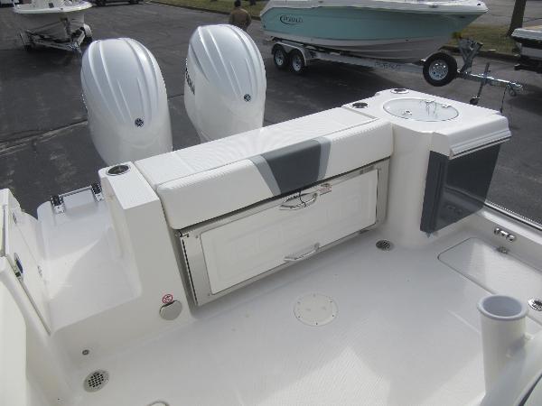 Slide: The Image of 2024 Robalo R250 Center Console boat with twin engines and rear seating. - 8