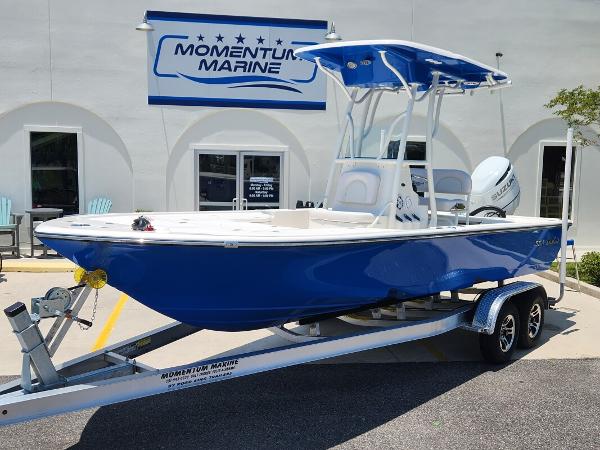 Slide: The Image of 2023 Sea Born FX22 Bay boat on trailer at Momentum Marine dealership. - 0