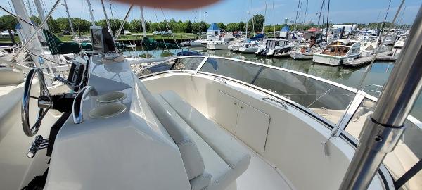 Slide: The Image of 2000 Silverton 392 Motor Yacht helm with marina view. - 13