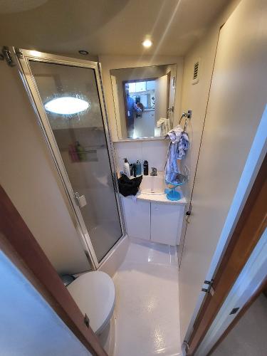 Slide: The Image of Bathroom interior of a 2000 Silverton 392 Motor Yacht with shower and vanity. - 41