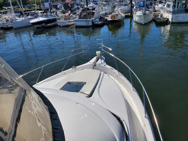Slide: The Image of 2000 Silverton 392 Motor Yacht docked at a marina with other boats. - 5