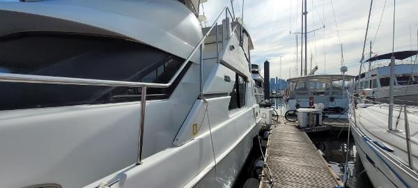 Slide: The Image of 2000 Silverton 392 Motor Yacht docked at a marina. - 8
