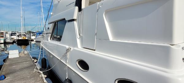 Slide: The Image of 2000 Silverton 392 Motor Yacht docked at a marina. - 9