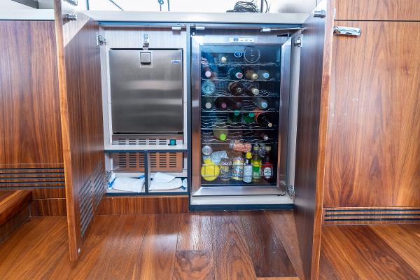 Slide: The Image of 2017 Sunseeker Manhattan 52 yacht interior with built-in fridge and ice maker. - 16
