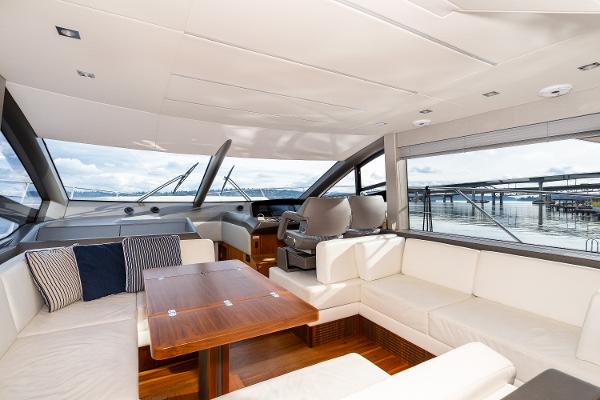 Slide: The Image of Interior of 2017 Sunseeker Manhattan 52 yacht with luxurious seating and wooden table. - 18