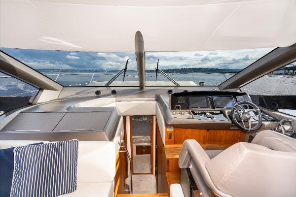 Slide: The Image of Interior helm of 2017 Sunseeker Manhattan 52 yacht with modern controls and panoramic view. - 19