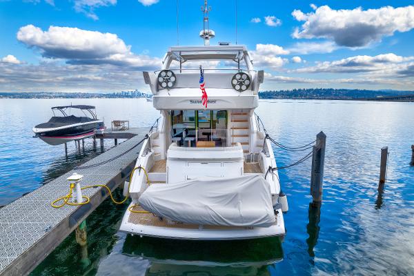 Slide: The Image of 2017 Sunseeker Manhattan 52 yacht docked at a marina on a sunny day. - 2
