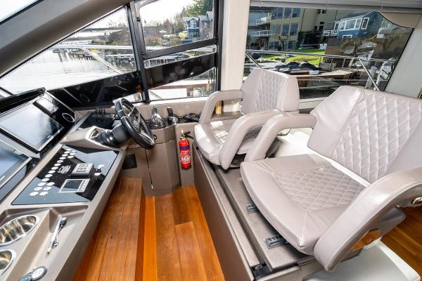 Slide: The Image of Cockpit of 2017 Sunseeker Manhattan 52 yacht with dual leather seats and modern controls. - 22