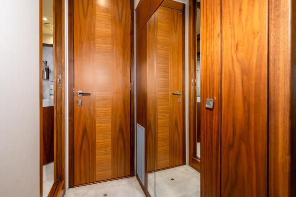 Slide: The Image of Luxurious wooden interior of 2017 Sunseeker Manhattan 52 yacht with mirrored door. - 31