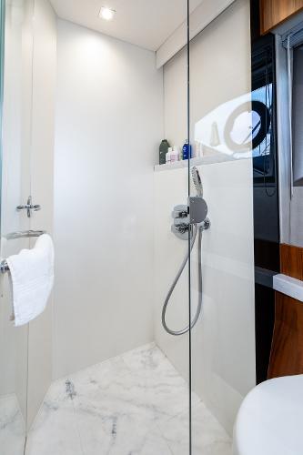 Slide: The Image of Modern shower area in 2017 Sunseeker Manhattan 52 yacht with glass door and marble floor. - 33