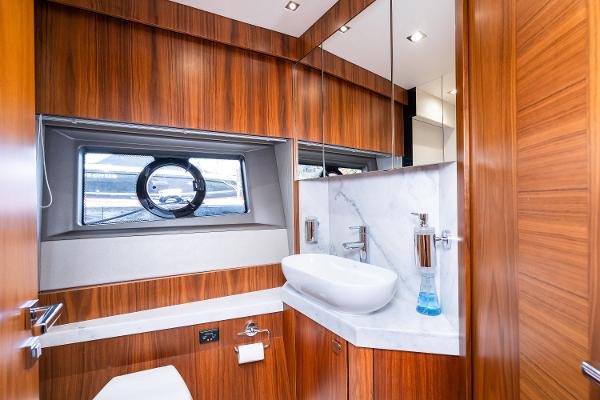 Slide: The Image of Luxurious bathroom in 2017 Sunseeker Manhattan 52 yacht with wood paneling and modern fixtures. - 37