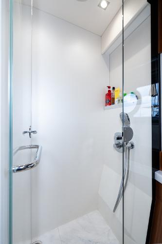 Slide: The Image of Modern shower area in 2017 Sunseeker Manhattan 52 yacht with glass door and sleek fixtures. - 39