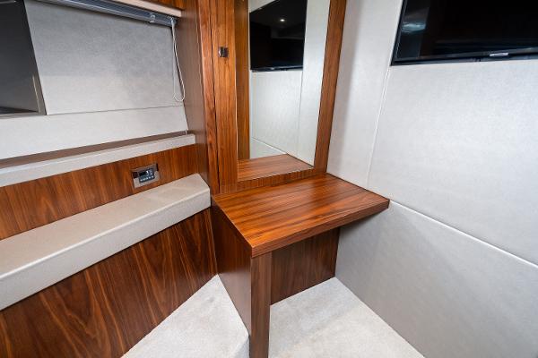 Slide: The Image of 2017 Sunseeker Manhattan 52 yacht interior, wooden vanity desk with mirror. - 49