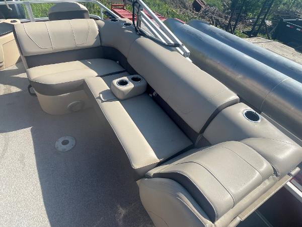 Slide: The Image of 2018 Sun Tracker Fishin' Barge 20 DLX interior seating area with cup holders. - 10