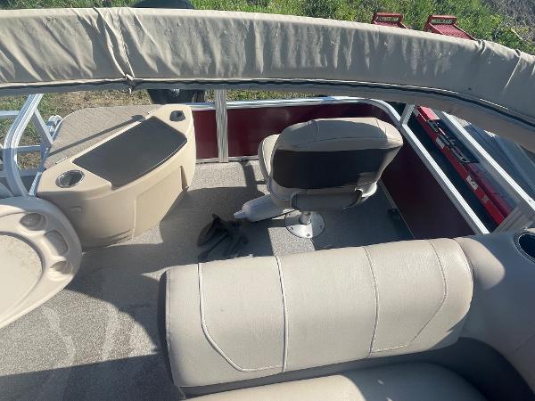 Slide: The Image of 2018 Sun Tracker Fishin' Barge 20 DLX interior with seating and console. - 12