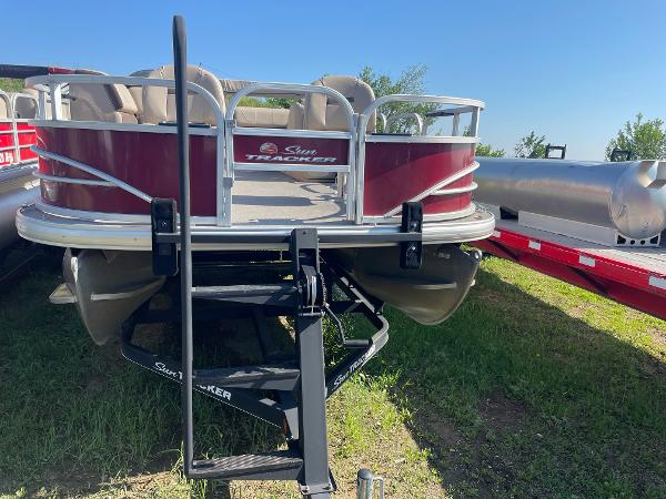 Slide: The Image of 2018 Sun Tracker Fishin' Barge 20 DLX pontoon boat on a trailer. - 2
