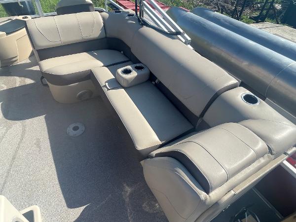 Slide: The Image of 2018 Sun Tracker Fishin' Barge 20 DLX interior seating area with cup holders. - 9