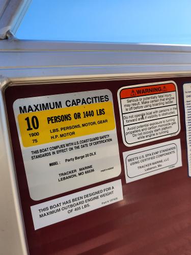 Slide: The Image of 2012 Sun Tracker Party Barge 20 DLX capacity and safety labels. - 22