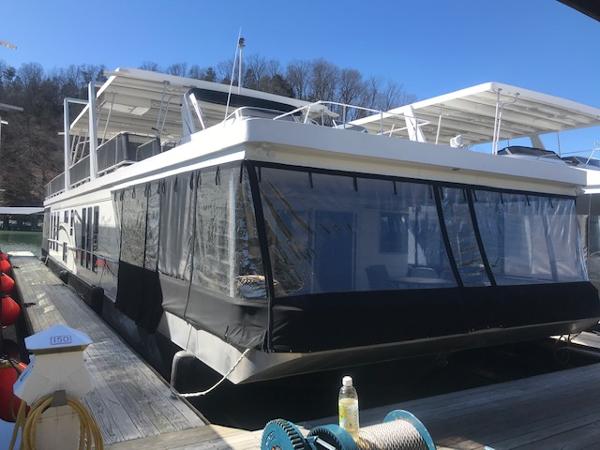Slide: The Image of 2007 Thoroughbred houseboat docked at a marina. - 1