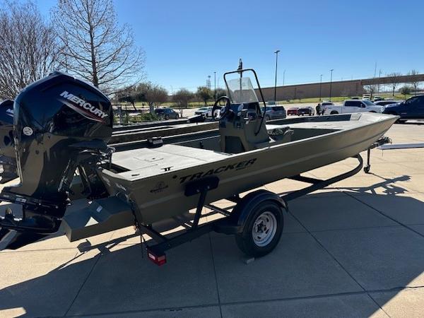 Slide: The Image of 2024 Tracker Grizzly 1754 SC boat with Mercury outboard motor on trailer. - 1