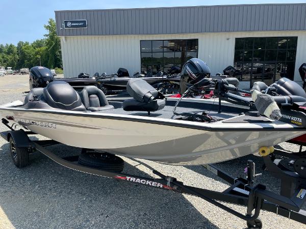 Slide: The Image of 2023 Tracker Pro Team 190 TX fishing boat on trailer outside dealership. - 1