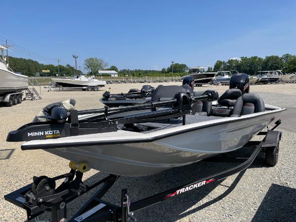 Slide: The Image of 2023 Tracker Pro Team 190 TX fishing boat on trailer in outdoor lot. - 2