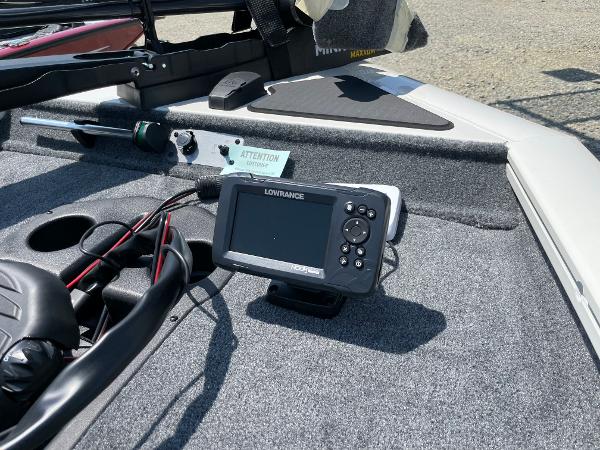 Slide: The Image of 2023 Tracker Pro Team 190 TX boat with Lowrance fish finder and control panel. - 9