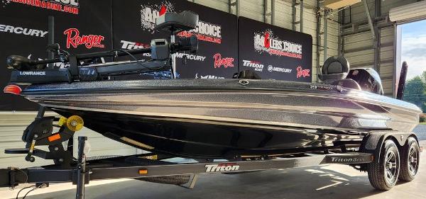 Slide: The Image of 2024 Triton 19 TrX Patriot boat on trailer in showroom. - 8