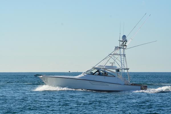 Slide: The Image of 2025 Viking 54 Open yacht cruising on the ocean. - 1