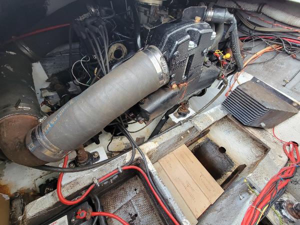 Slide: The Image of 1986 Wellcraft 2800 Coastal Offshore Fisherman engine compartment with visible wiring and components. - 11