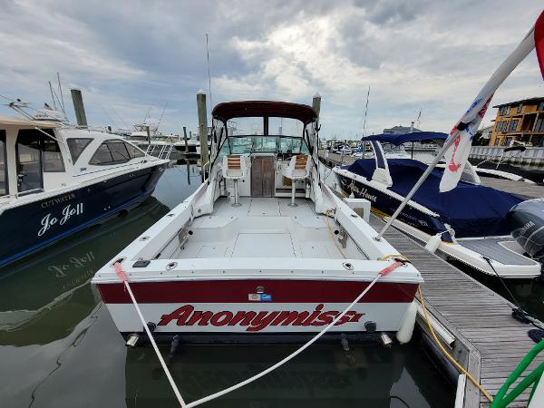 Slide: The Image of 1986 Wellcraft 2800 Coastal Offshore Fisherman docked at marina. - 3