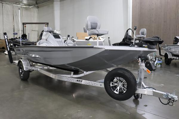 Slide: The Image of 2023 Xpress H17 fishing boat on a trailer in a showroom. - 0